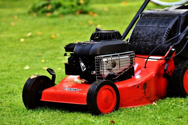 A lawnmower keeping a vibrant lawn maintained.