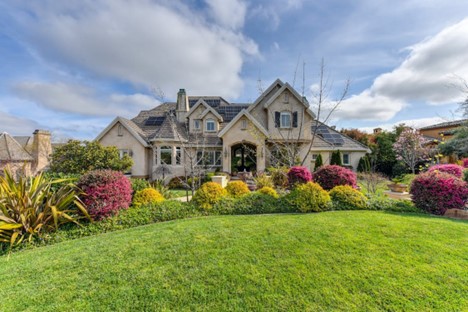 A large estate with a lush lawn.