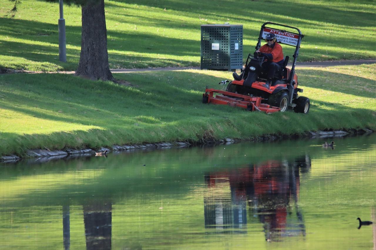 A professional lawn care expert maintaining a pristine landscape.