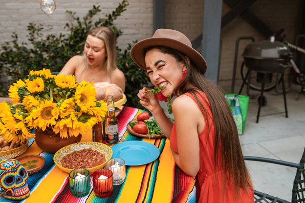 Two women enjoying an outdoor lunch