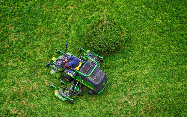 Professional lawn mower cutting grass